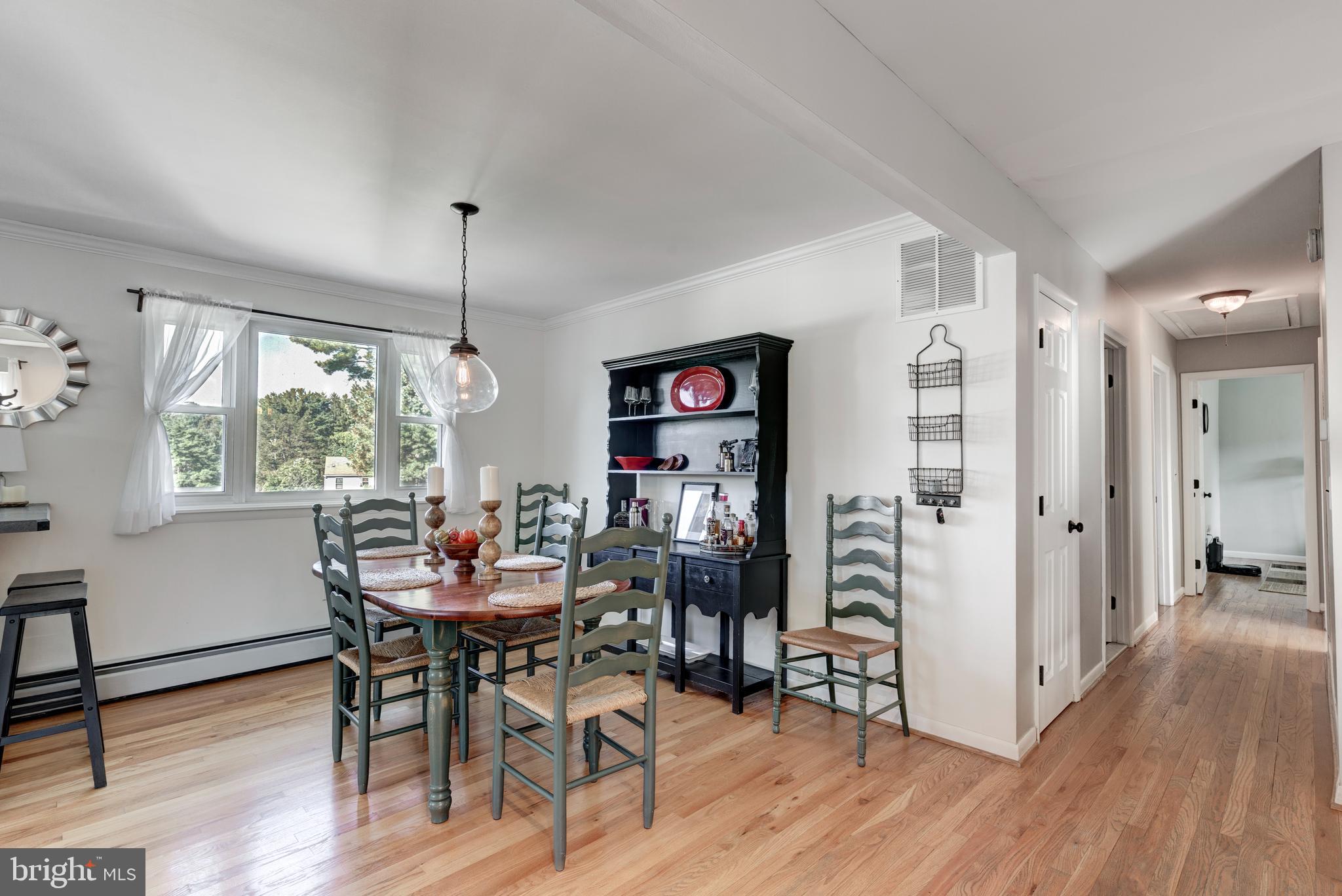 2108 Hanover Pike Hampstead, MD 21074 - Photo 13 of 51 a view of a dining room with furniture window and wooden floor