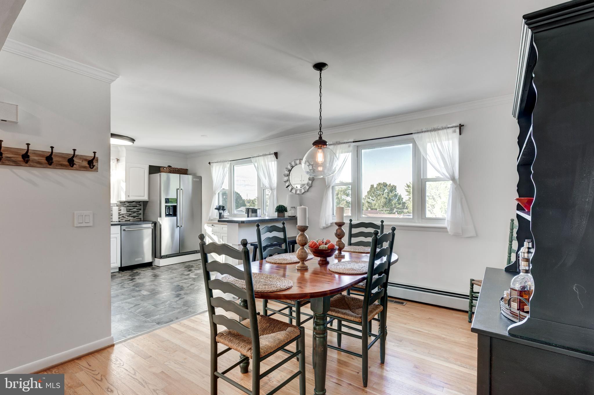 2108 Hanover Pike Hampstead, MD 21074 - Photo 15 of 51 a view of a dining room with furniture window and wooden floor