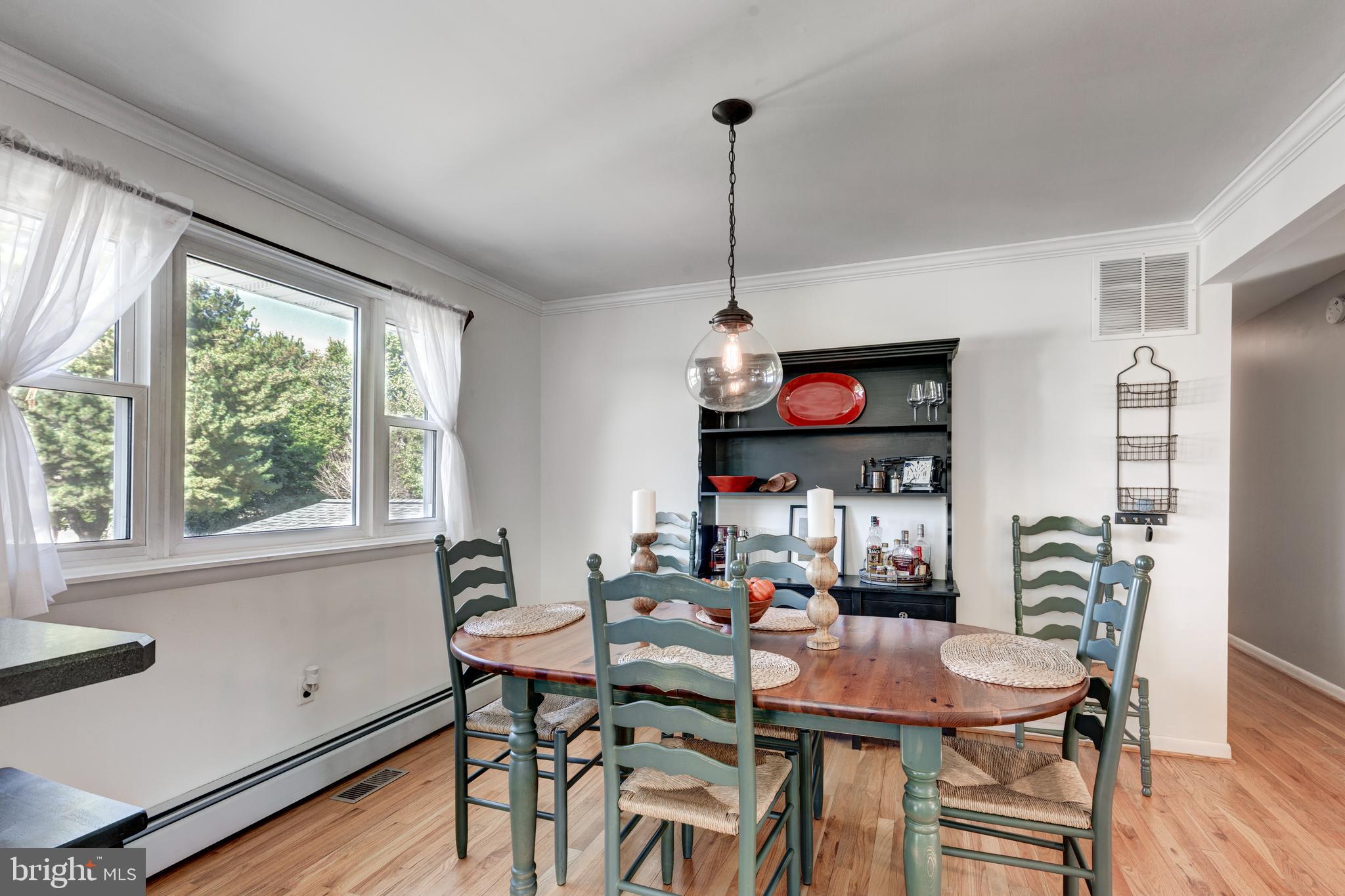 2108 Hanover Pike Hampstead, MD 21074 - Photo 17 of 51 a view of a dining room with furniture window and wooden floor