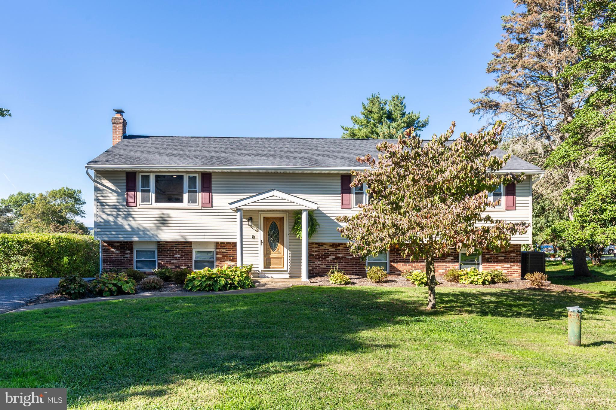 2108 Hanover Pike Hampstead, MD 21074 - Photo 2 of 51 a front view of a house with a garden