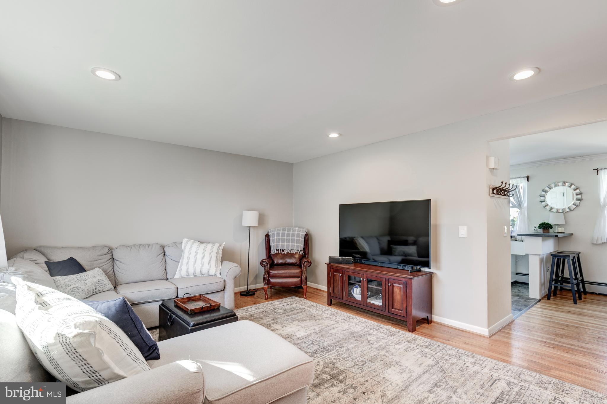 2108 Hanover Pike Hampstead, MD 21074 - Photo 21 of 51 a living room with furniture and a flat screen tv