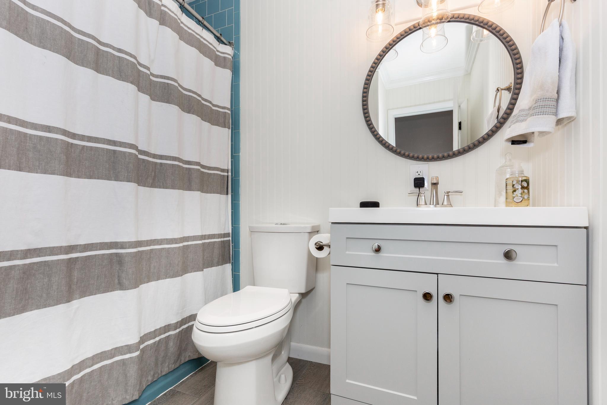 2108 Hanover Pike Hampstead, MD 21074 - Photo 22 of 51 a bathroom with a sink mirror vanity and toilet