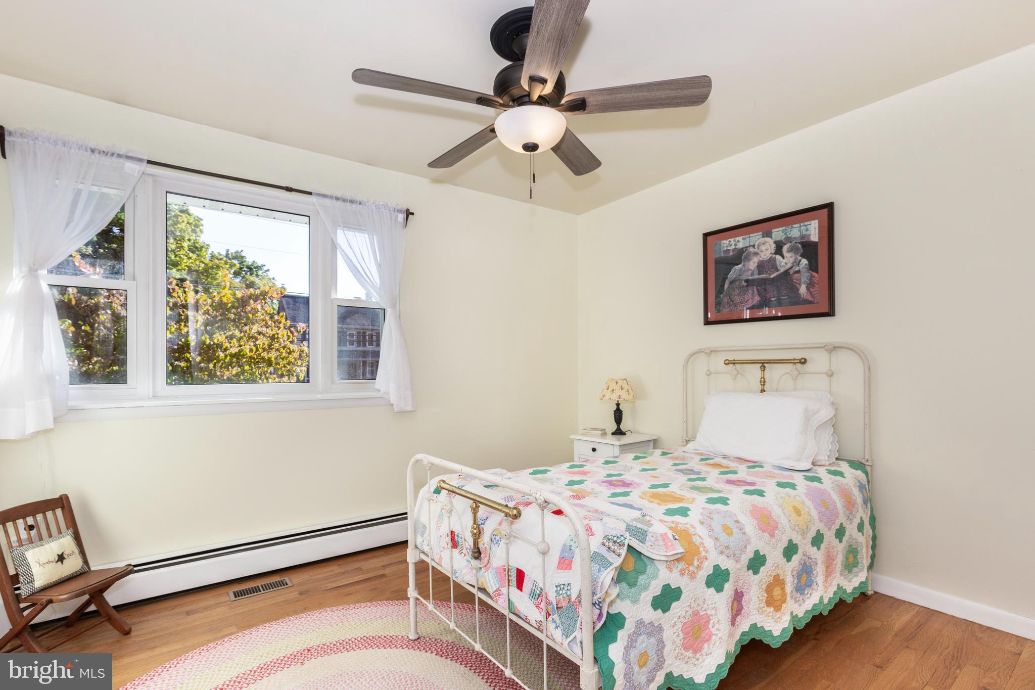 2108 Hanover Pike Hampstead, MD 21074 - Photo 23 of 51 a bedroom with a bed and a chandelier