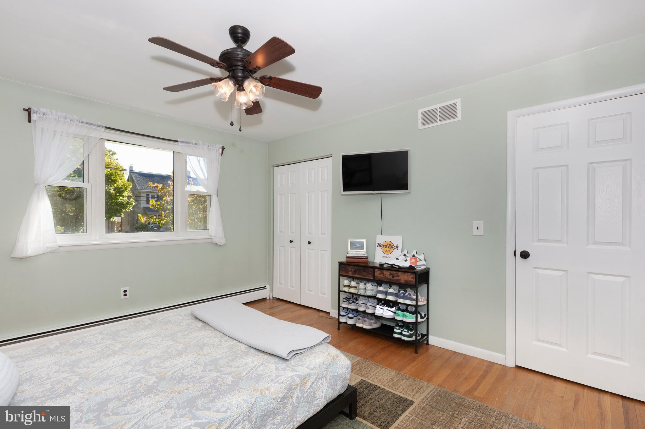 2108 Hanover Pike Hampstead, MD 21074 - Photo 26 of 51 a bedroom with a bed and a chandelier