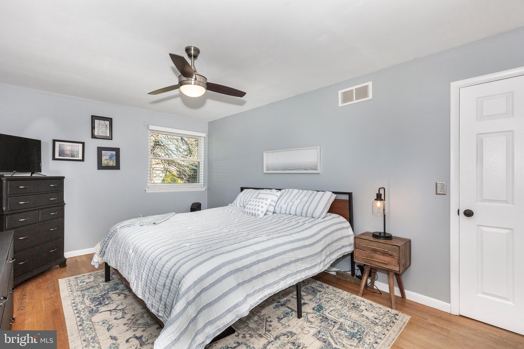 2108 Hanover Pike Hampstead, MD 21074 - Photo 28 of 51 a bedroom with a bed and a chandelier