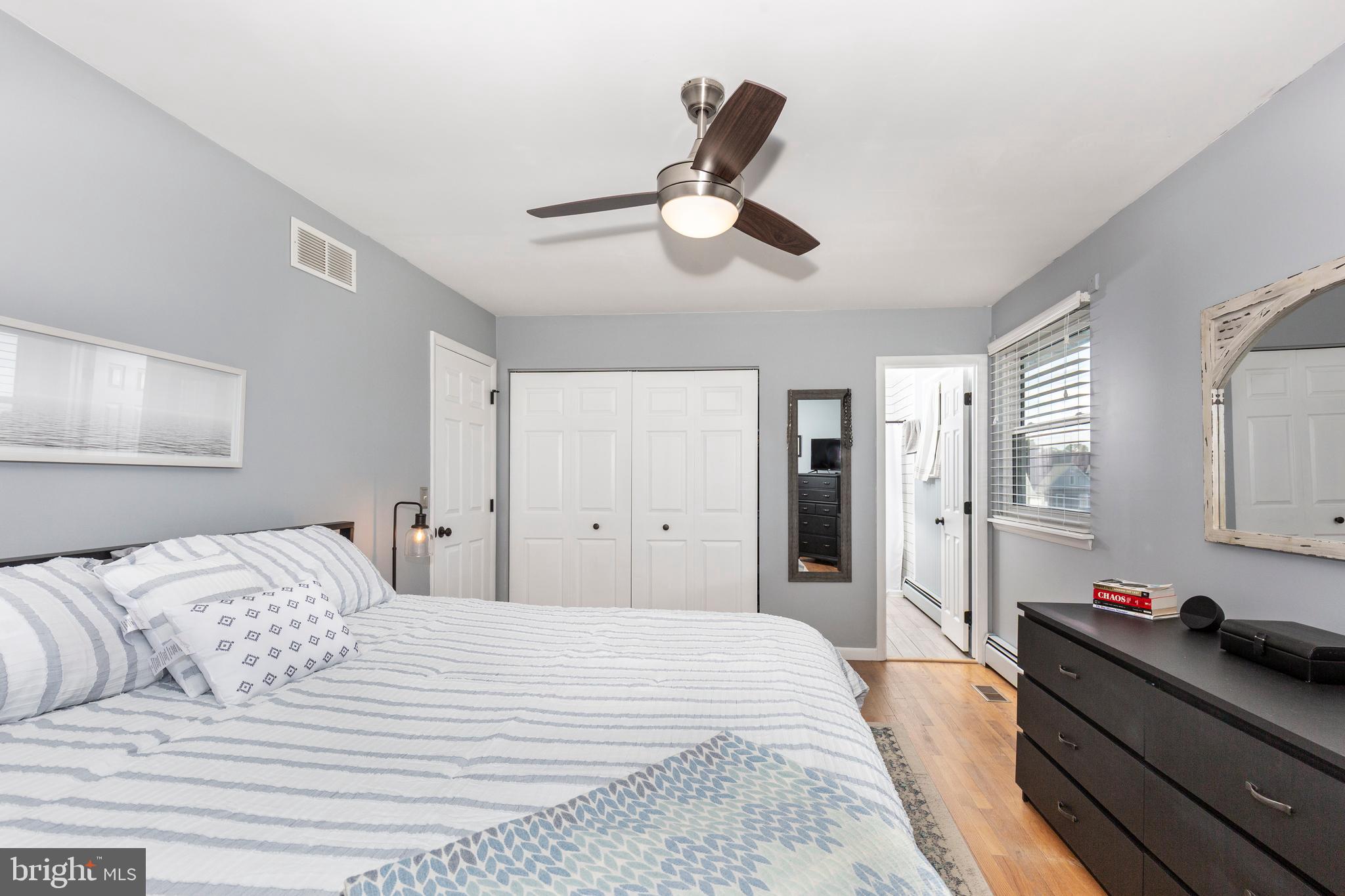 2108 Hanover Pike Hampstead, MD 21074 - Photo 29 of 51 a bedroom with a bed and a chandelier