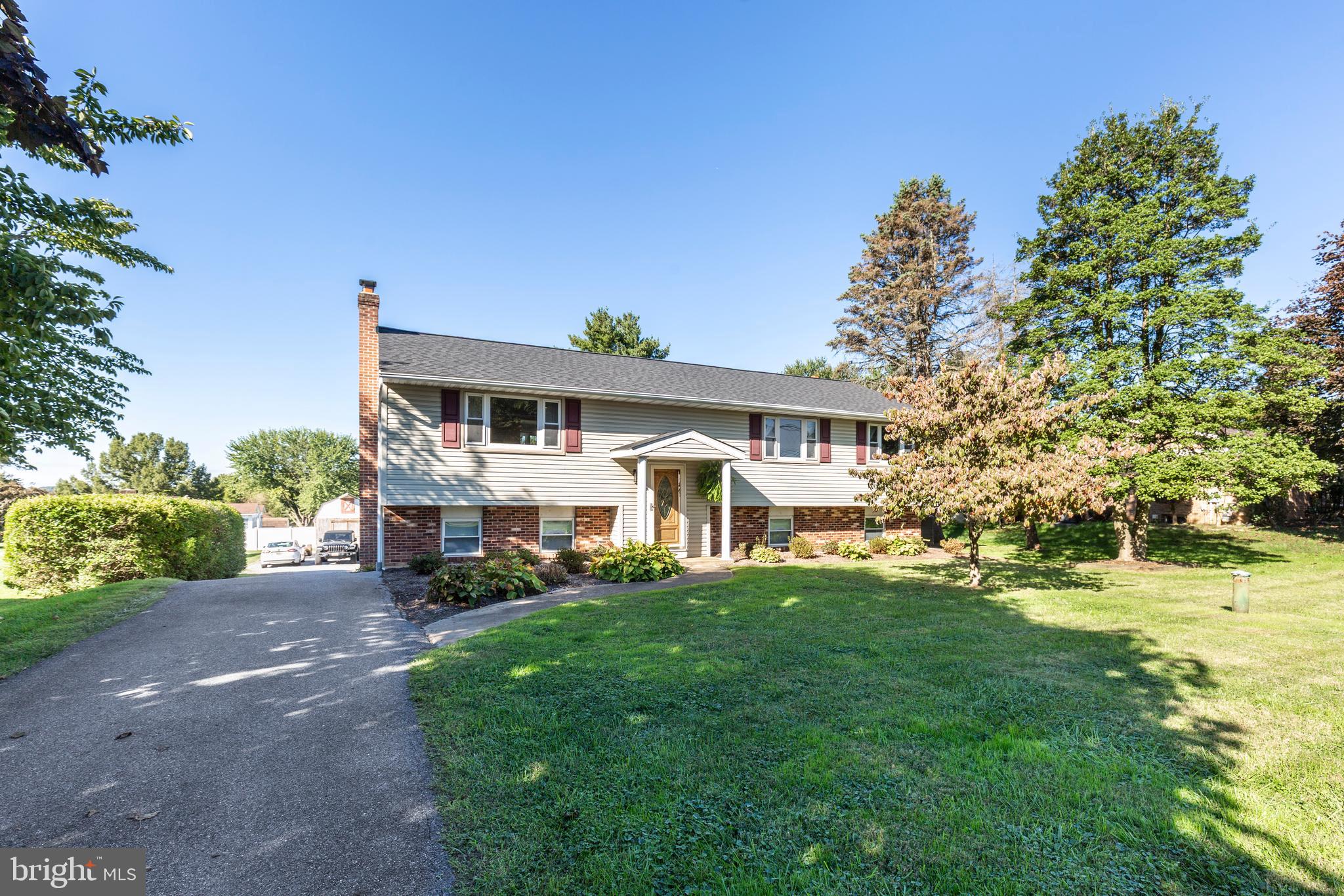 2108 Hanover Pike Hampstead, MD 21074 - Photo 3 of 51 a front view of a house with a garden