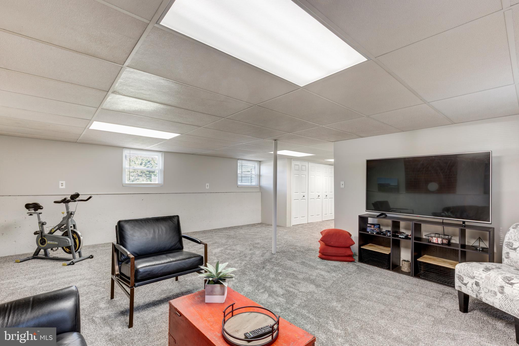 2108 Hanover Pike Hampstead, MD 21074 - Photo 34 of 51 a living room with furniture and a flat screen tv