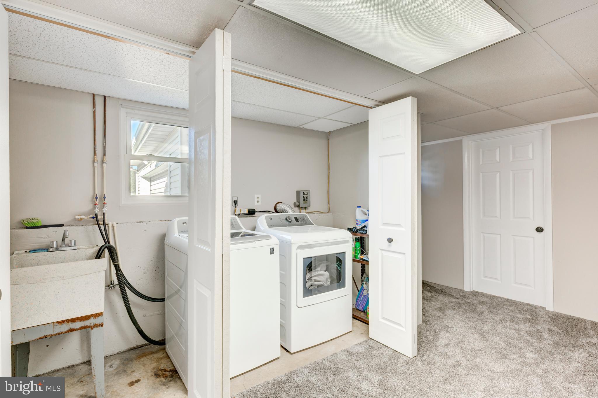 2108 Hanover Pike Hampstead, MD 21074 - Photo 35 of 51 a view of living room and washer dryer