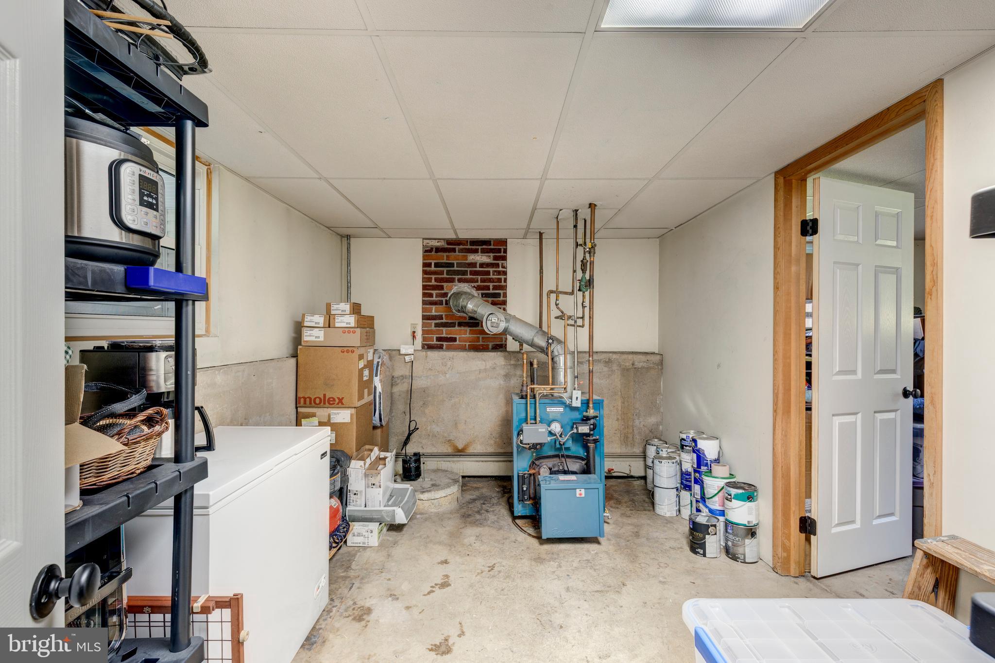 2108 Hanover Pike Hampstead, MD 21074 - Photo 38 of 51 a room with furniture a washer and dryer
