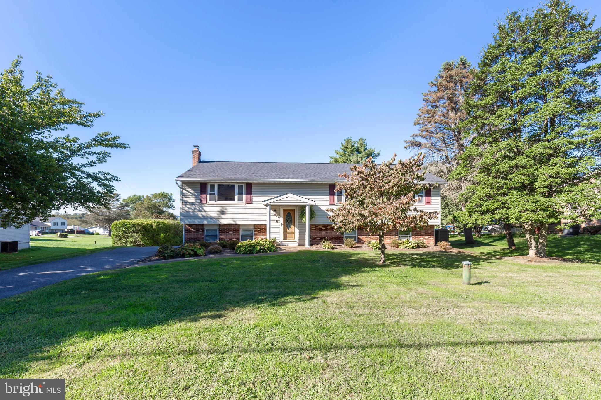 2108 Hanover Pike Hampstead, MD 21074 - Photo 4 of 51 a front view of a house with a yard