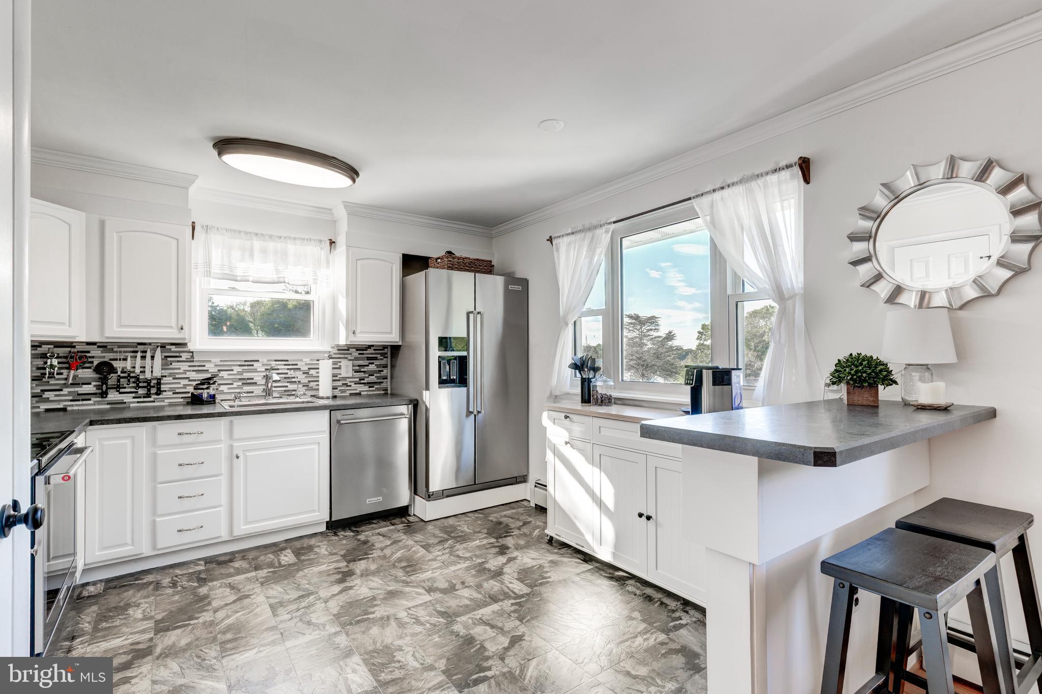2108 Hanover Pike Hampstead, MD 21074 - Photo 8 of 51 a kitchen with stainless steel appliances granite countertop a sink stove and refrigerator
