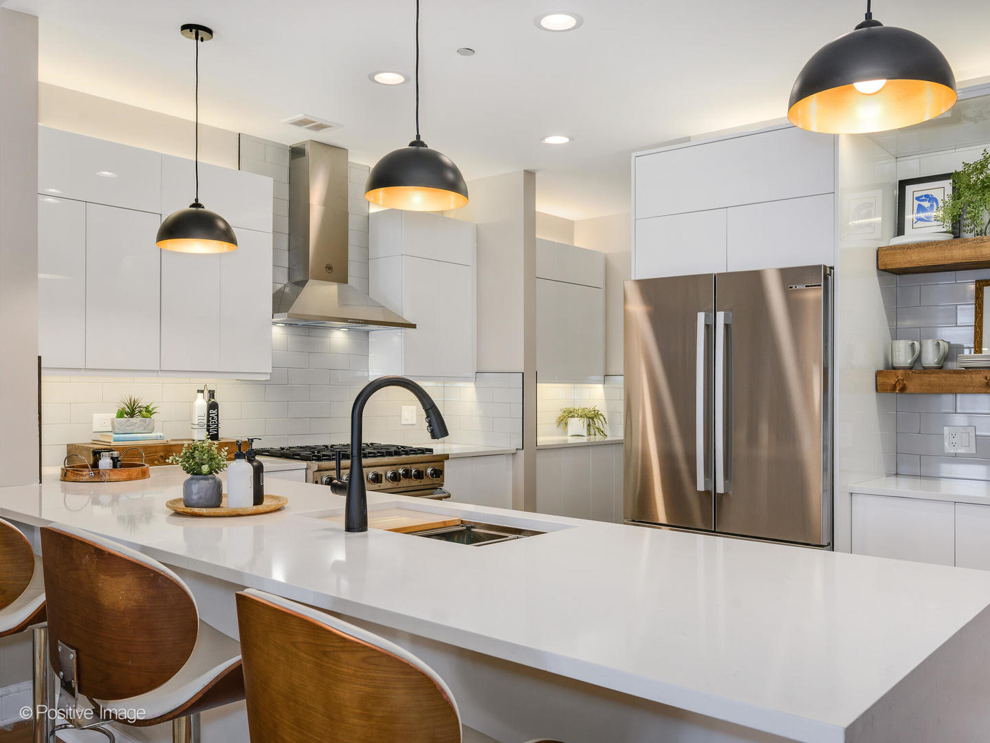 333 North Canal Street, Unit 2003 Chicago, IL 60606 - Photo 15 of 31 a kitchen with stainless steel appliances a refrigerator a sink a stove and a wooden floors