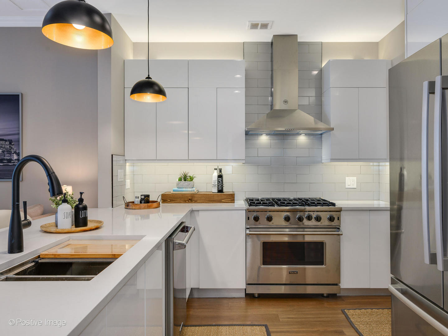 333 North Canal Street, Unit 2003 Chicago, IL 60606 - Photo 16 of 31 a kitchen with stainless steel appliances granite countertop a sink a stove and refrigerator