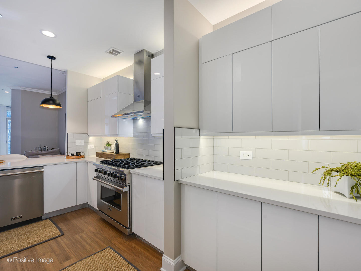 333 North Canal Street, Unit 2003 Chicago, IL 60606 - Photo 17 of 31 a kitchen with stainless steel appliances granite countertop a sink a stove and a refrigerator