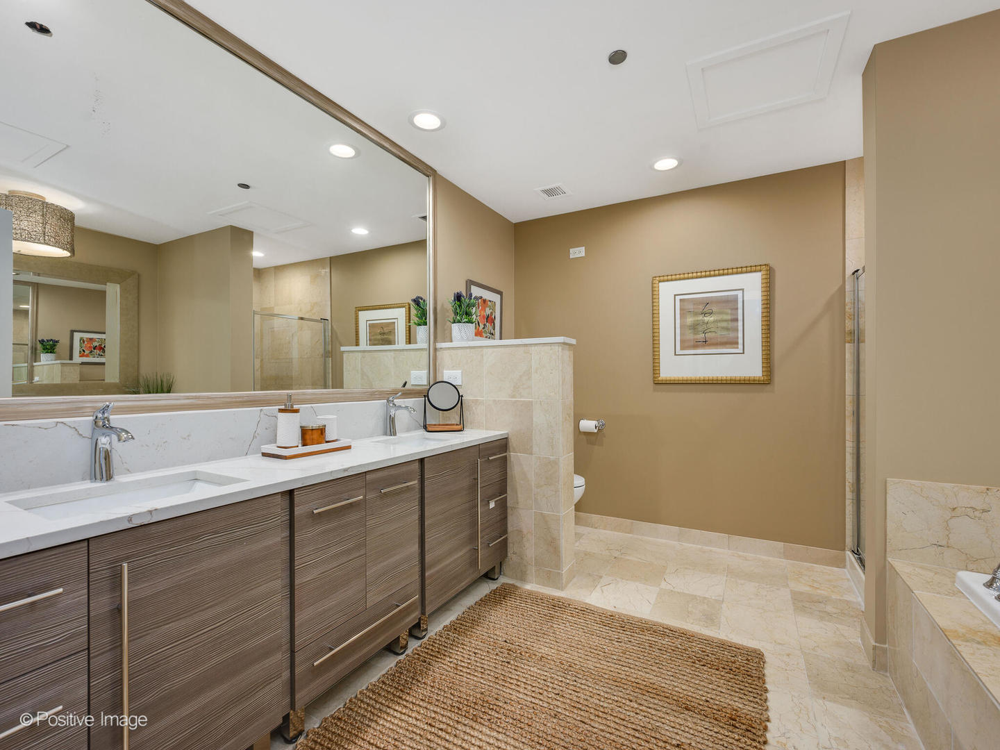 333 North Canal Street, Unit 2003 Chicago, IL 60606 - Photo 22 of 31 a bathroom with a double vanity sink and a mirror