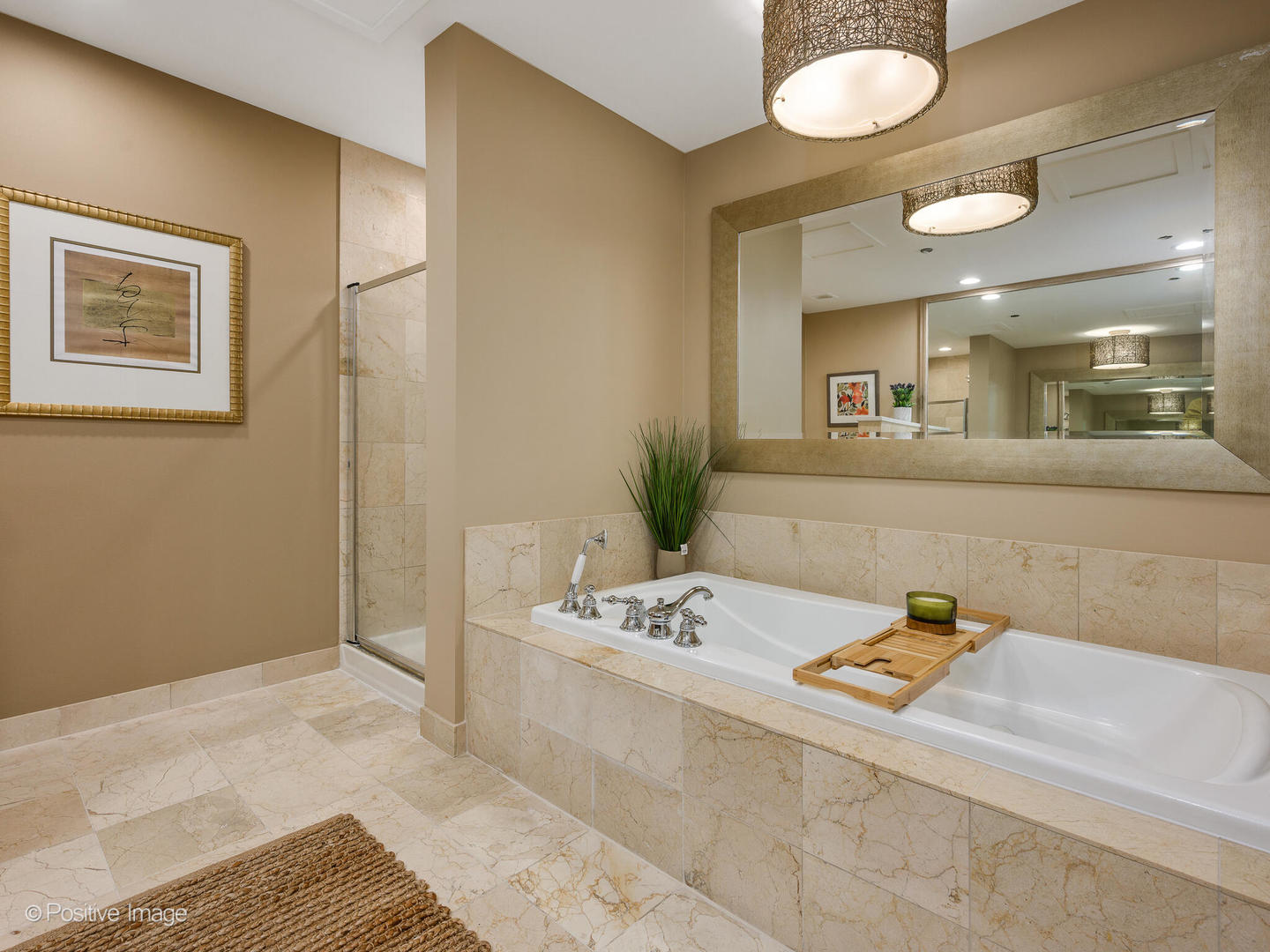 333 North Canal Street, Unit 2003 Chicago, IL 60606 - Photo 24 of 31 a bathroom with a sink a mirror and a shower