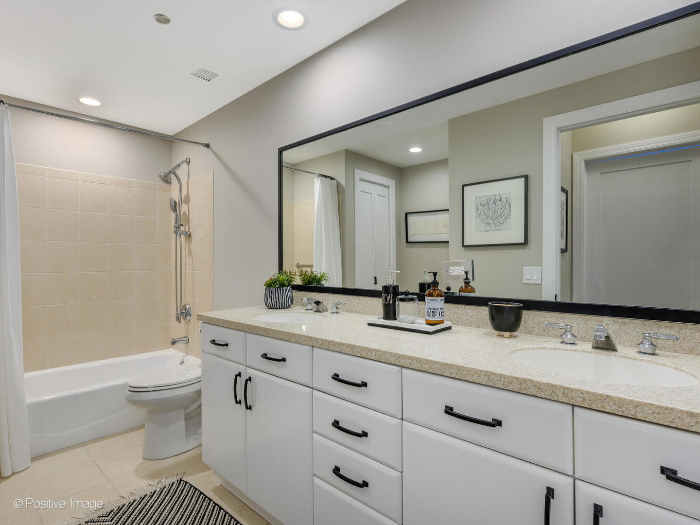 333 North Canal Street, Unit 2003 Chicago, IL 60606 - Photo 27 of 31 a spacious bathroom with a granite countertop sink mirror and toilet