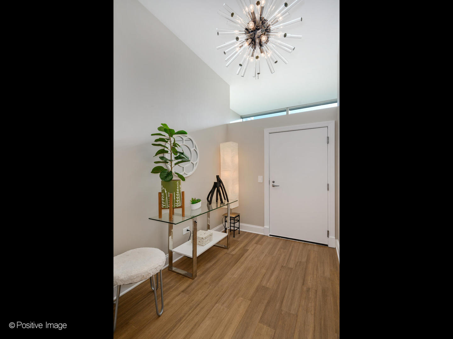 333 North Canal Street, Unit 2003 Chicago, IL 60606 - Photo 3 of 31 a view of a hallway with wooden floor and a chandelier