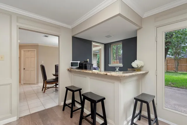 a dining room with furniture and window
