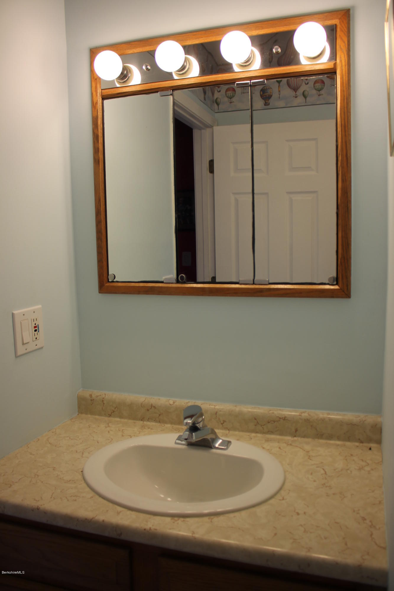 1006 West Center Road Otis, MA 01253 - Photo 17 of 22 a bathroom with a sink and a mirror