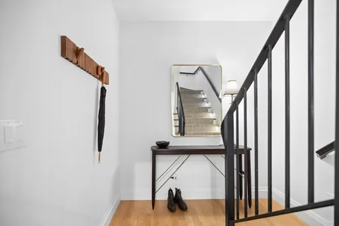 a view of staircase with railing and stairs