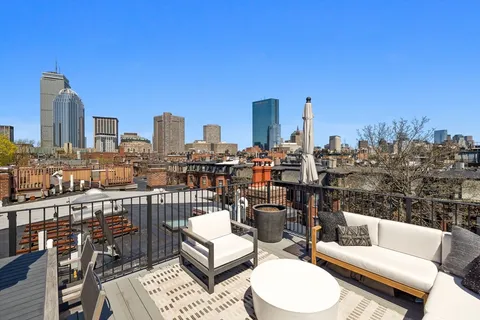 a view of a city with tall buildings