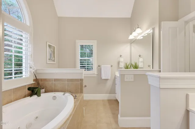 a bathroom with a bathtub and a sink