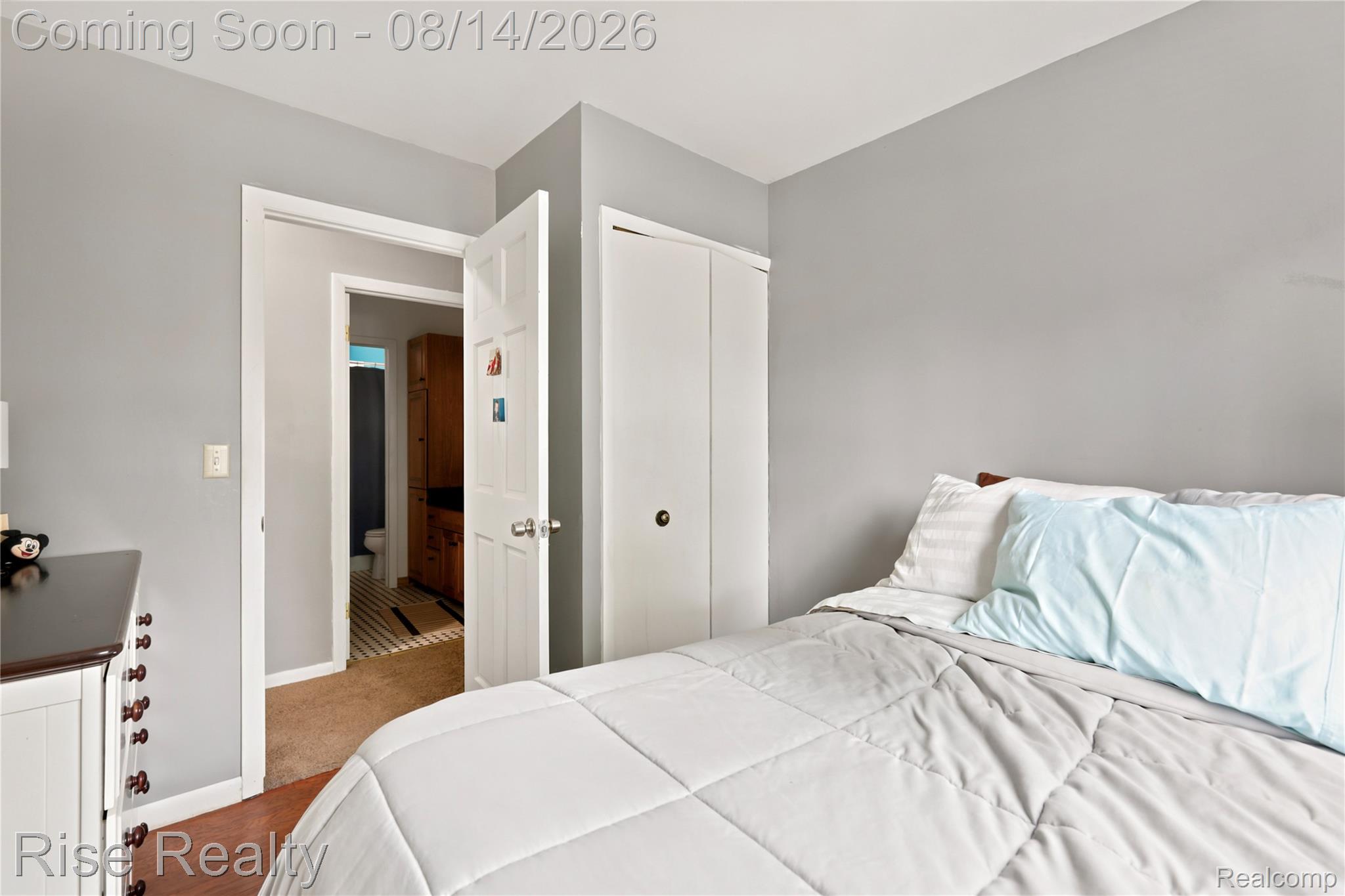10215 West Frances Road Flushing, MI 48433 - Photo 18 of 31 Bright secondary bedroom featuring hardwood flooring, soft gray walls, and abundant natural light