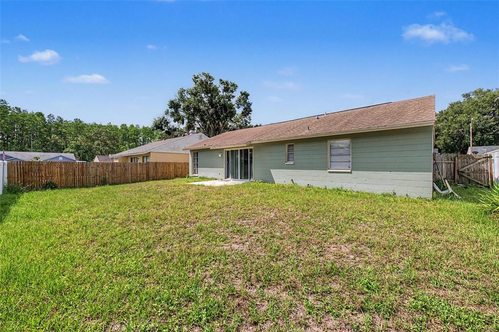 1632 Pintail Court Lutz, FL 33549 - Photo 27 of 34 a front view of house with a garden