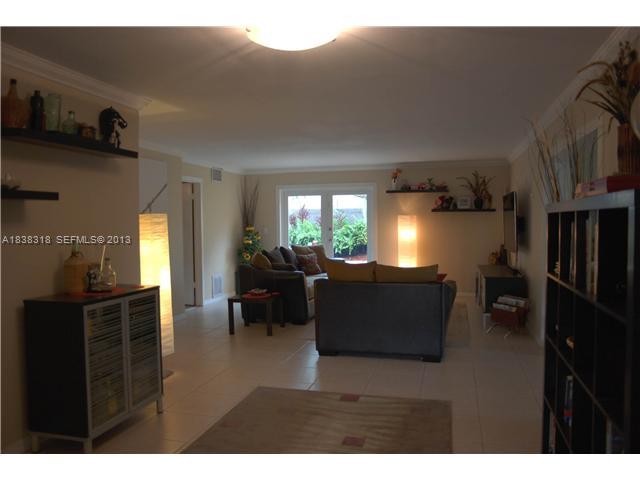 3339 West Park Road Hollywood, FL 33021 - Photo 2 of 15 a living room with furniture and a flat screen tv
