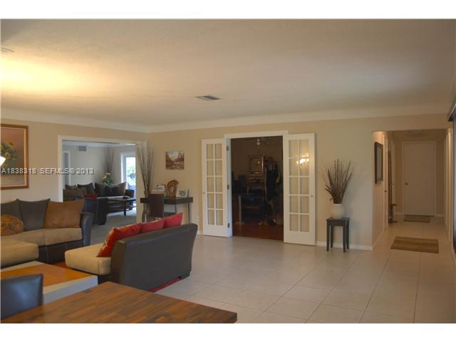 3339 West Park Road Hollywood, FL 33021 - Photo 3 of 15 a living room with furniture and a window
