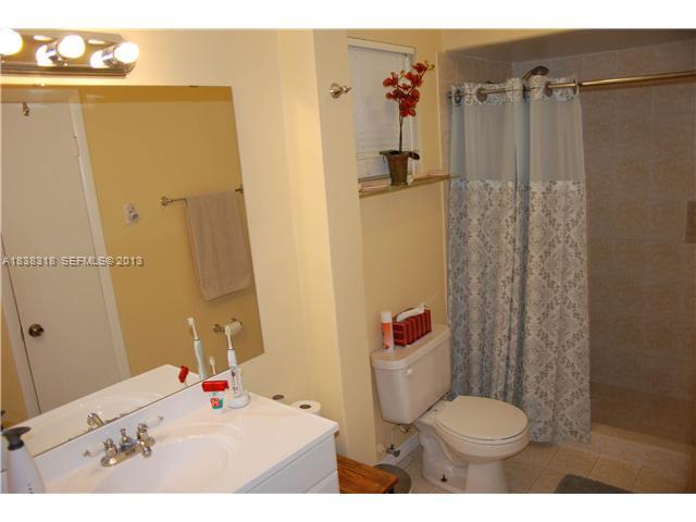 3339 West Park Road Hollywood, FL 33021 - Photo 6 of 15 a bathroom with a sink toilet and shower
