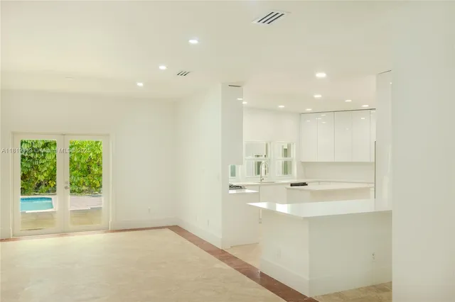 a view of a kitchen with a sink and window