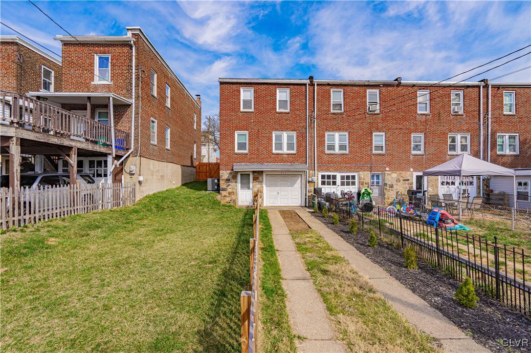 711 Spring Street Bethlehem, PA 18018 - Photo 25 of 26 a front view of a residential apartment building with a yard