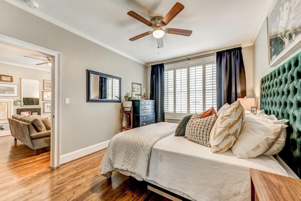 28 Collier Road Northwest, Unit 11 Atlanta, GA 30309 - Photo 12 of 23 a bedroom with a large bed and a chandelier