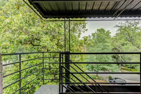 a view of balcony with wooden floor