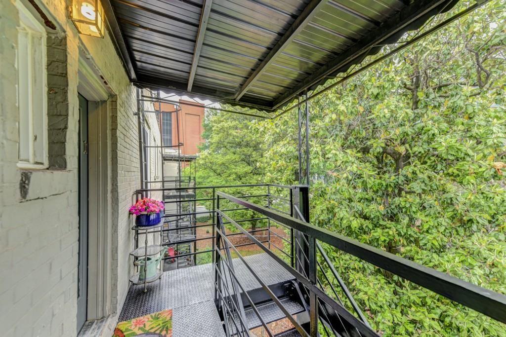 28 Collier Road Northwest, Unit 11 Atlanta, GA 30309 - Photo 18 of 23 a view of balcony with wooden floor