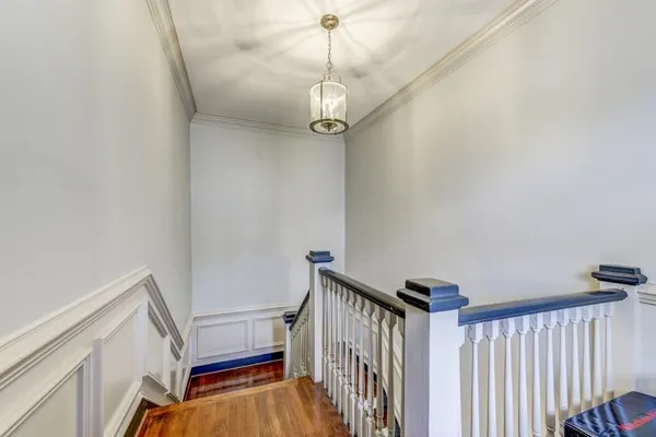 a view of a hallway with stairs