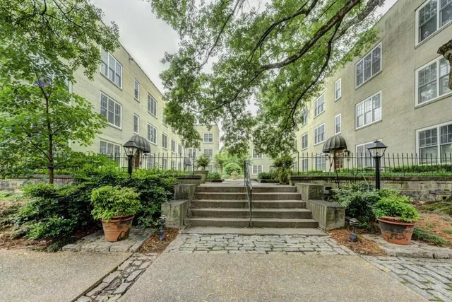 a front view of a building with garden