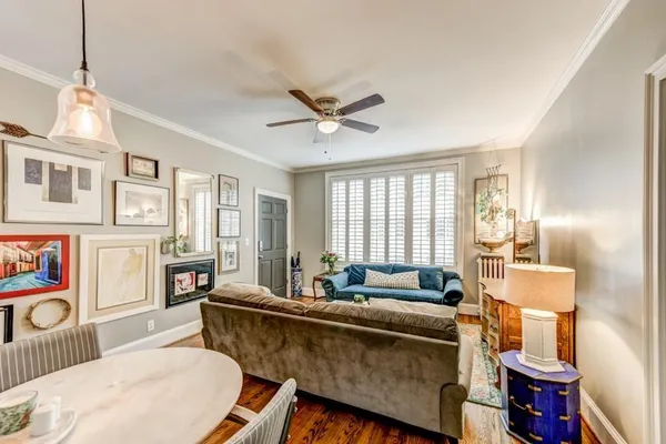 a living room with furniture and a window