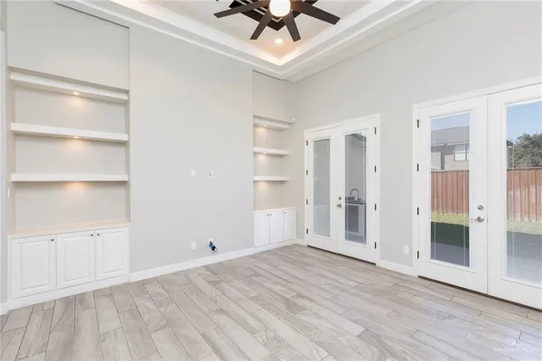 a view of an empty room with a window