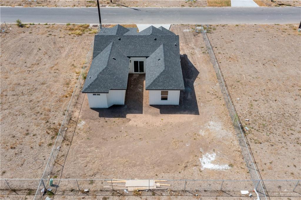 2317 Tuscany Road Weslaco, TX 78596 - Photo 12 of 13 a aerial view of a house with a yard