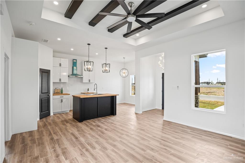 2317 Tuscany Road Weslaco, TX 78596 - Photo 2 of 13 a large kitchen with stainless steel appliances kitchen island a large counter top and a refrigerator