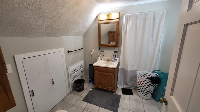 a bathroom with a sink and mirror
