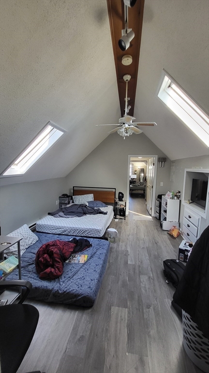 118 Gershom Avenue, Unit 3 Lowell, MA 01854 - Photo 7 of 9 a living room with furniture and a fireplace
