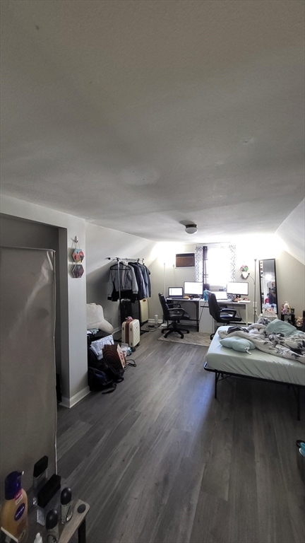 118 Gershom Avenue, Unit 3 Lowell, MA 01854 - Photo 8 of 9 a living room with furniture and a wooden floor