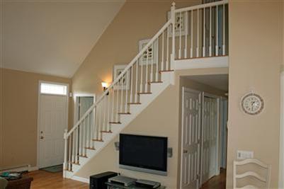 55 Ruggles Road Orleans, MA 02653 - Photo 6 of 30 a view of staircase with wooden floor and stairs