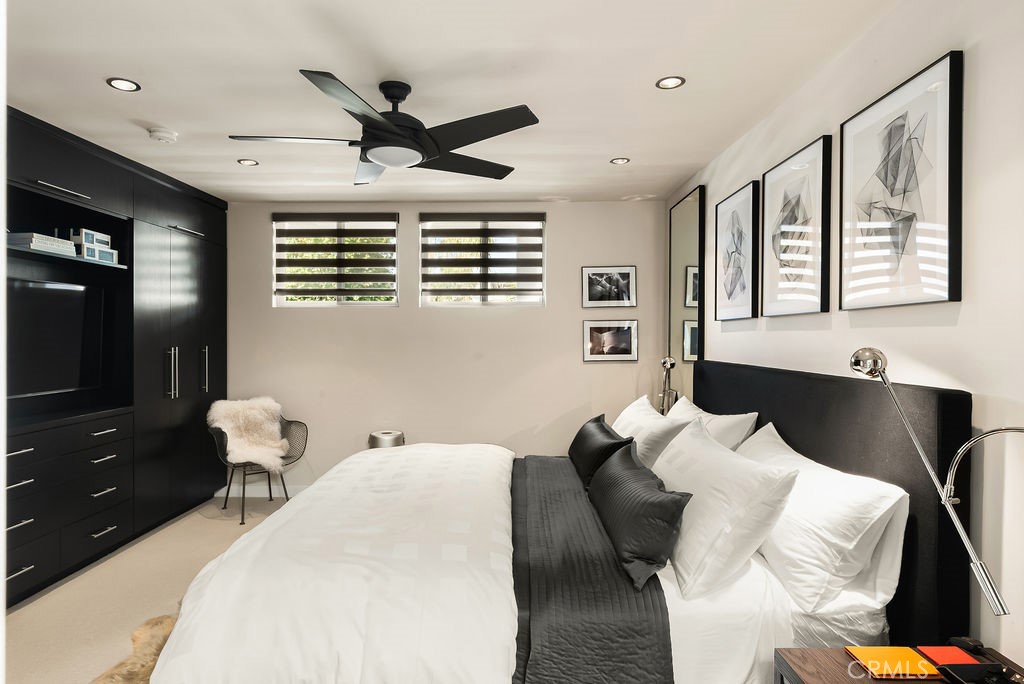 1585 South Coast Highway, Unit 66 Laguna Beach, CA 92651 - Photo 12 of 18 a bed room with a bed and furniture