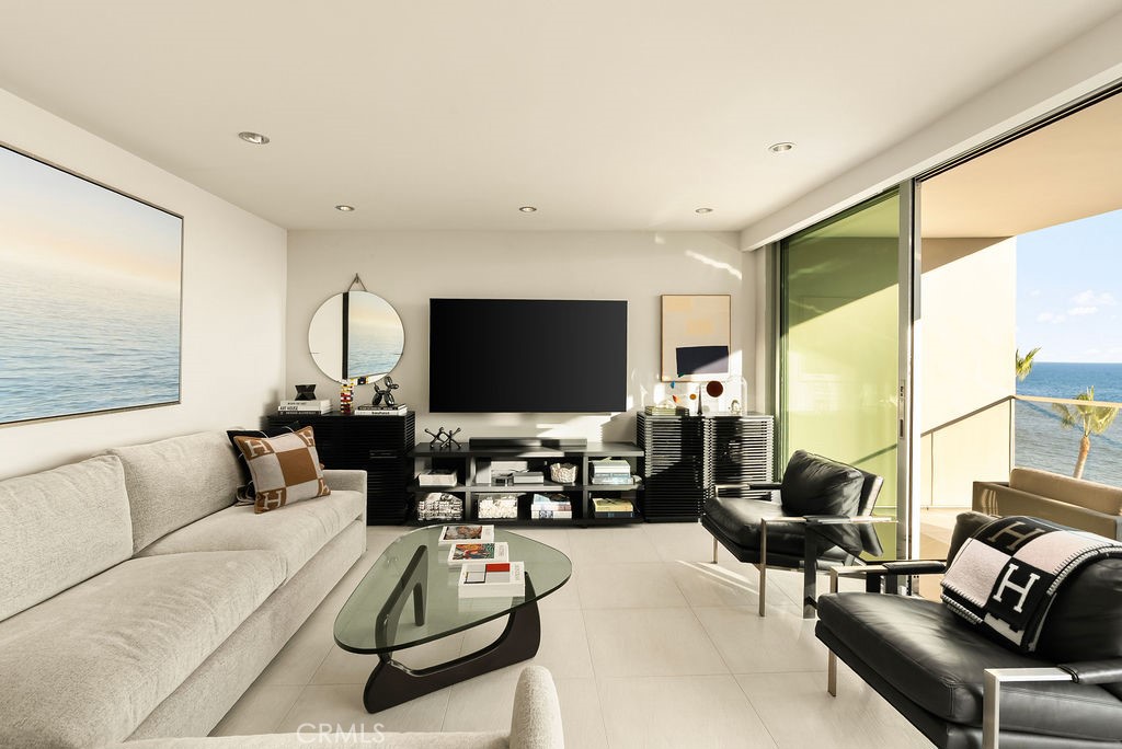 1585 South Coast Highway, Unit 66 Laguna Beach, CA 92651 - Photo 2 of 18 a living room with furniture and a flat screen tv